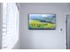 Modern wall with a flatscreen tv, light switch and window with wooden blinds at 8725 E Vista Dr, Scottsdale, AZ 85250