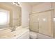 Bathroom with a single sink vanity and glass shower doors at 9512 E Kilarea Ave, Mesa, AZ 85209