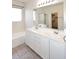 Bathroom featuring dual sinks, a separate shower, a bathtub, tile flooring and natural light at 9512 E Kilarea Ave, Mesa, AZ 85209