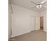 Neutral bedroom with a ceiling fan, carpet and closet doors at 9512 E Kilarea Ave, Mesa, AZ 85209
