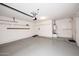 Garage with gray floors and shelves at 9512 E Kilarea Ave, Mesa, AZ 85209