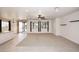 Bright living area featuring tile floors, recessed lighting, and patio access at 9512 E Kilarea Ave, Mesa, AZ 85209