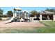 Community playground with slides and covered picnic area; a great outdoor space for families at 9512 E Kilarea Ave, Mesa, AZ 85209