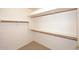 Walk-in closet with custom shelves and ample storage space at 9512 E Kilarea Ave, Mesa, AZ 85209