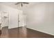 This bedroom features white walls and trim, plus wood flooring and doors to a closet and another room at 955 E Knox Rd # 224, Chandler, AZ 85225