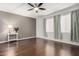 Expansive bedroom with a ceiling fan, dark hardwood flooring, neutral paint and natural light at 955 E Knox Rd # 224, Chandler, AZ 85225