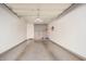 A spacious garage has painted walls and an epoxy floor, with hooks for wall storage at 955 E Knox Rd # 224, Chandler, AZ 85225