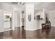 Open-concept living area with hardwood floors, white trim, and easy access to the kitchen and bathroom at 955 E Knox Rd # 224, Chandler, AZ 85225