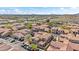 An aerial view of a neighborhood showcases beautiful houses, landscaping, and mountain views in the background at 1024 E Frye Rd # 1093, Phoenix, AZ 85048