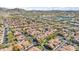 An aerial view of the neighborhood features houses with a desert-style landscape and a view of nearby water at 1024 E Frye Rd # 1093, Phoenix, AZ 85048