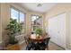 Bright breakfast nook with large windows, a charming table, and lots of natural light at 1024 E Frye Rd # 1093, Phoenix, AZ 85048