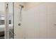 Modern walk-in shower with white tile and glass door at 1024 E Frye Rd # 1093, Phoenix, AZ 85048