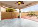 Covered back patio with desert landscaping, brick and concrete flooring, and a ceiling fan at 10320 E Tupelo Ave, Mesa, AZ 85212