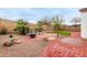 Serene backyard featuring artificial grass, a beautiful water feature, and a charming seating area at 10320 E Tupelo Ave, Mesa, AZ 85212