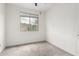 A bedroom featuring carpeted floors, a window with blinds, and white walls at 10320 E Tupelo Ave, Mesa, AZ 85212