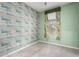 A cozy bedroom featuring wood-patterned accent wall and carpeted floors at 10320 E Tupelo Ave, Mesa, AZ 85212