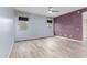 Spacious room featuring gray wood-look tile floors and a ceiling fan at 10320 E Tupelo Ave, Mesa, AZ 85212