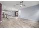 Spacious living area with neutral walls, tile floors, and ceiling fan creating a versatile open space at 10320 E Tupelo Ave, Mesa, AZ 85212