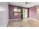 Well-lit living room featuring gray wood-look tile floors and a ceiling fan at 10320 E Tupelo Ave, Mesa, AZ 85212