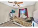 Stylish bedroom showcasing a leopard print bed, a large wall mirror, and colorful window dressings at 1061 E Poncho Ln, San Tan Valley, AZ 85143