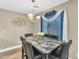 Stylish dining room with a marble-top table and modern chandelier, perfect for Gathering meals at 1061 E Poncho Ln, San Tan Valley, AZ 85143