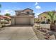 Charming two-story home with a neutral color palette and a spacious two-car garage at 1061 E Poncho Ln, San Tan Valley, AZ 85143