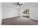 An empty bedroom offers lots of natural light from the sliding glass doors to the outside patio at 1061 S Palo Verde St, Mesa, AZ 85208