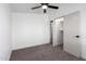 A clean bedroom with a ceiling fan, a walk-in closet, and neutral paint creates a serene space at 1061 S Palo Verde St, Mesa, AZ 85208