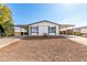 Charming single-story home with a covered parking and low-maintenance gravel landscaping at 1061 S Palo Verde St, Mesa, AZ 85208