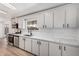 Bright kitchen with stainless steel appliances, new countertops, and freshly painted white cabinets at 1061 S Palo Verde St, Mesa, AZ 85208