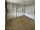 Bedroom featuring tile flooring and built-in storage cabinets and shelving at 10955 N 79Th N Ave # 34, Peoria, AZ 85345