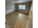 Bedroom features tile flooring, a window, and neutral color scheme at 10955 N 79Th N Ave # 34, Peoria, AZ 85345