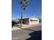 Cozy single story home with palm tree, manicured gravel landscaping, and a covered porch at 10955 N 79Th N Ave # 34, Peoria, AZ 85345