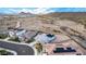 Aerial view of a desert community, showcasing single-Gathering homes and beautiful mountain views at 11366 W Ashby Dr, Peoria, AZ 85383