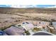 Aerial view of a desert community, showcasing single-Gathering homes and mountain views at 11366 W Ashby Dr, Peoria, AZ 85383