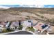 Aerial view of homes in a desert landscape, showcasing tiled roofs, solar panels, and spacious lots at 11366 W Ashby Dr, Peoria, AZ 85383