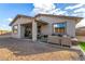 Outdoor living space boasting a covered patio with desert landscaping and comfortable seating at 11366 W Ashby Dr, Peoria, AZ 85383