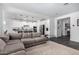 Open concept living room and kitchen area with modern white cabinetry at 11366 W Ashby Dr, Peoria, AZ 85383