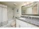 Bathroom featuring a granite countertop vanity, white cabinetry, and a shower-tub combination at 12212 N Paradise Village S Pkwy # 136, Phoenix, AZ 85032