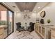 Bright dining area with glass table, black chairs, and plenty of space for entertaining at 12212 N Paradise Village S Pkwy # 136, Phoenix, AZ 85032