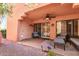 Covered patio with comfortable seating, a ceiling fan, and access to a private outdoor space at 12212 N Paradise Village S Pkwy # 136, Phoenix, AZ 85032