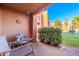 Comfortable outdoor patio with seating, decorative elements, and serene courtyard scenery at 12212 N Paradise Village S Pkwy # 136, Phoenix, AZ 85032