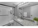 Renovated bathroom with granite counters, tiled shower, and modern fixtures at 14002 N 49Th Ave # 1029, Glendale, AZ 85306