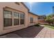 Backyard with a cozy patio area and a privacy wall at 15480 W Corrine Dr, Surprise, AZ 85379