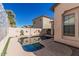 Backyard with a refreshing swimming pool at 15480 W Corrine Dr, Surprise, AZ 85379