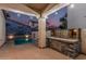 Outdoor kitchen featuring a grill and a swimming pool at 15480 W Corrine Dr, Surprise, AZ 85379