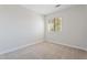 Cozy bedroom with a neutral color scheme, plush carpet, and a window with blinds at 1728 E Barbarita Ave, Gilbert, AZ 85234