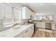 Sunlit kitchen showcases ample counter space, modern backsplash, and stainless appliances at 1728 E Barbarita Ave, Gilbert, AZ 85234