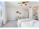 Inviting bedroom showcases neutral colors, comfy seating, and ensuite bathroom at 1728 E Barbarita Ave, Gilbert, AZ 85234