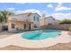 Inviting backyard featuring a private pool, covered patio, and ample space for outdoor activities at 1728 E Barbarita Ave, Gilbert, AZ 85234